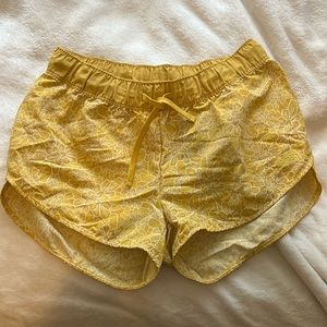 North face yellow floral shorts